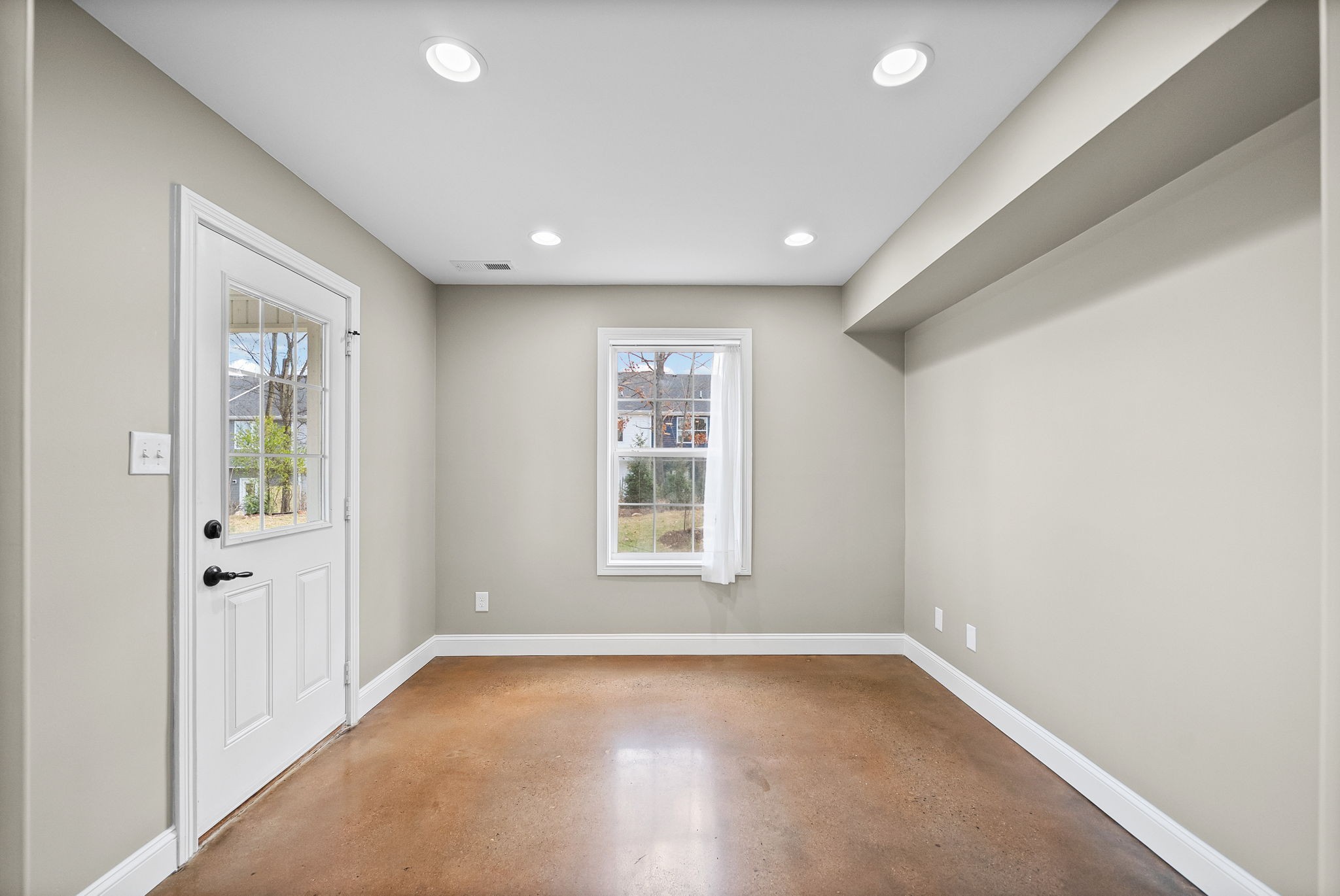 1903 East Boy Scout Road Clarksville, TN 37042 - Photo 14 of 36 an empty room with wooden floor and windows