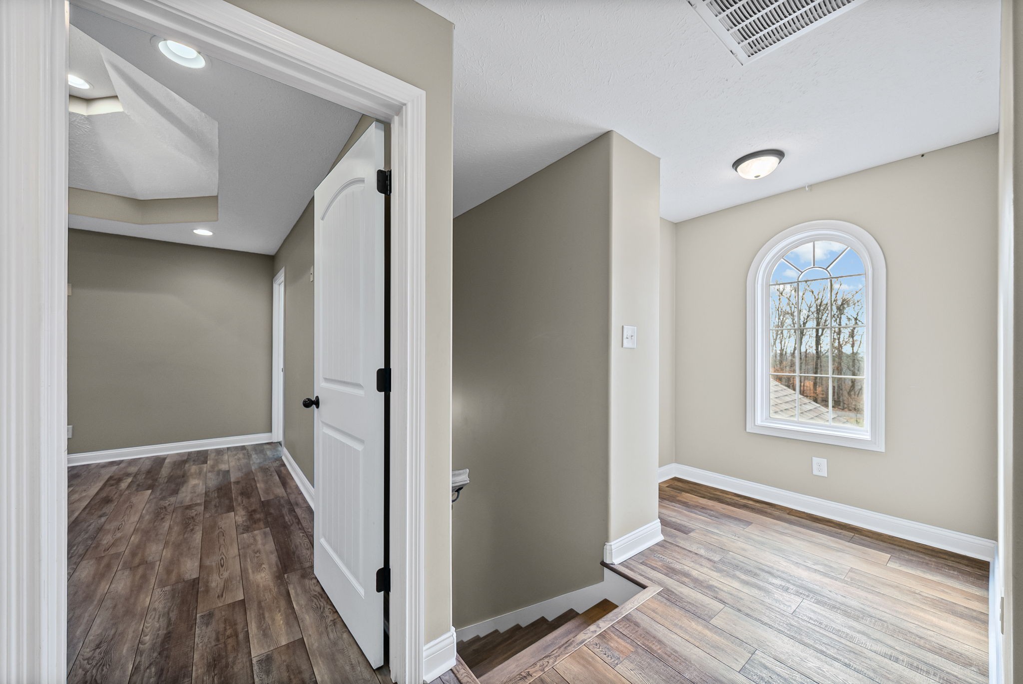 1903 East Boy Scout Road Clarksville, TN 37042 - Photo 17 of 36 a view of hallway with windows and wooden floor
