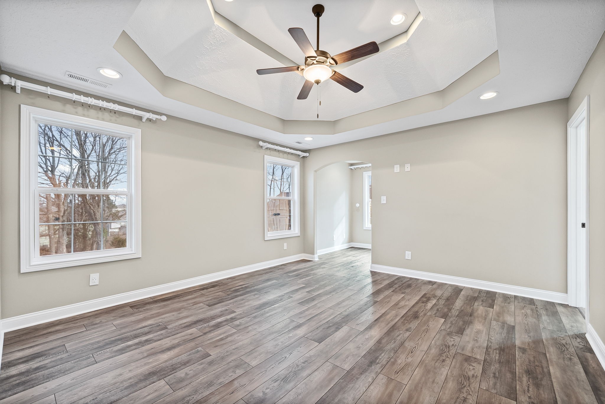 1903 East Boy Scout Road Clarksville, TN 37042 - Photo 18 of 36 a view of an empty room with wooden floor and a window