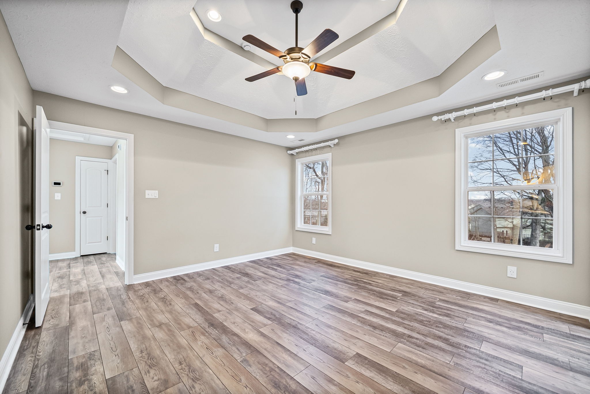 1903 East Boy Scout Road Clarksville, TN 37042 - Photo 19 of 36 a view of empty room with wooden floor and fan
