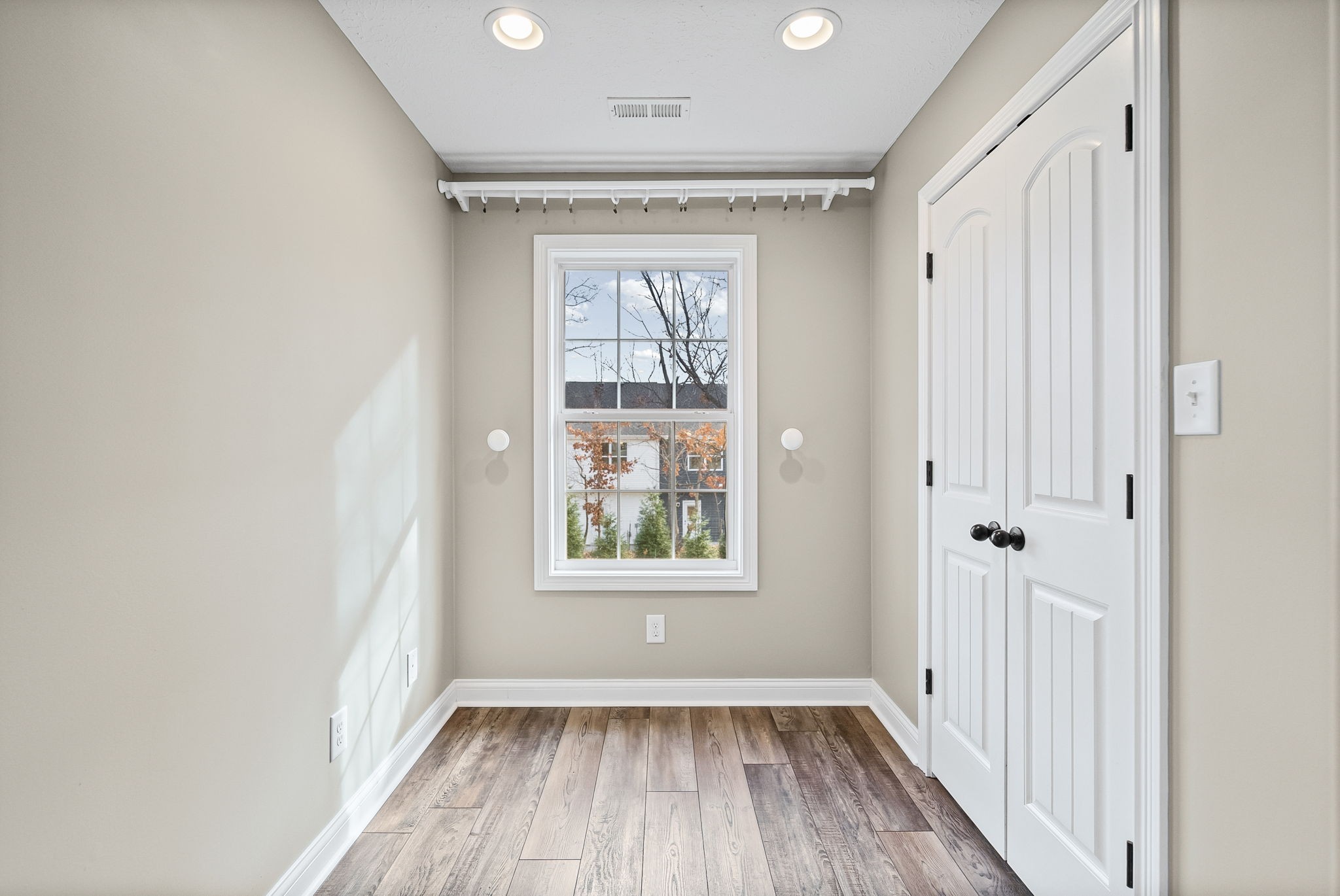 1903 East Boy Scout Road Clarksville, TN 37042 - Photo 21 of 36 wooden floor in an empty room with a window