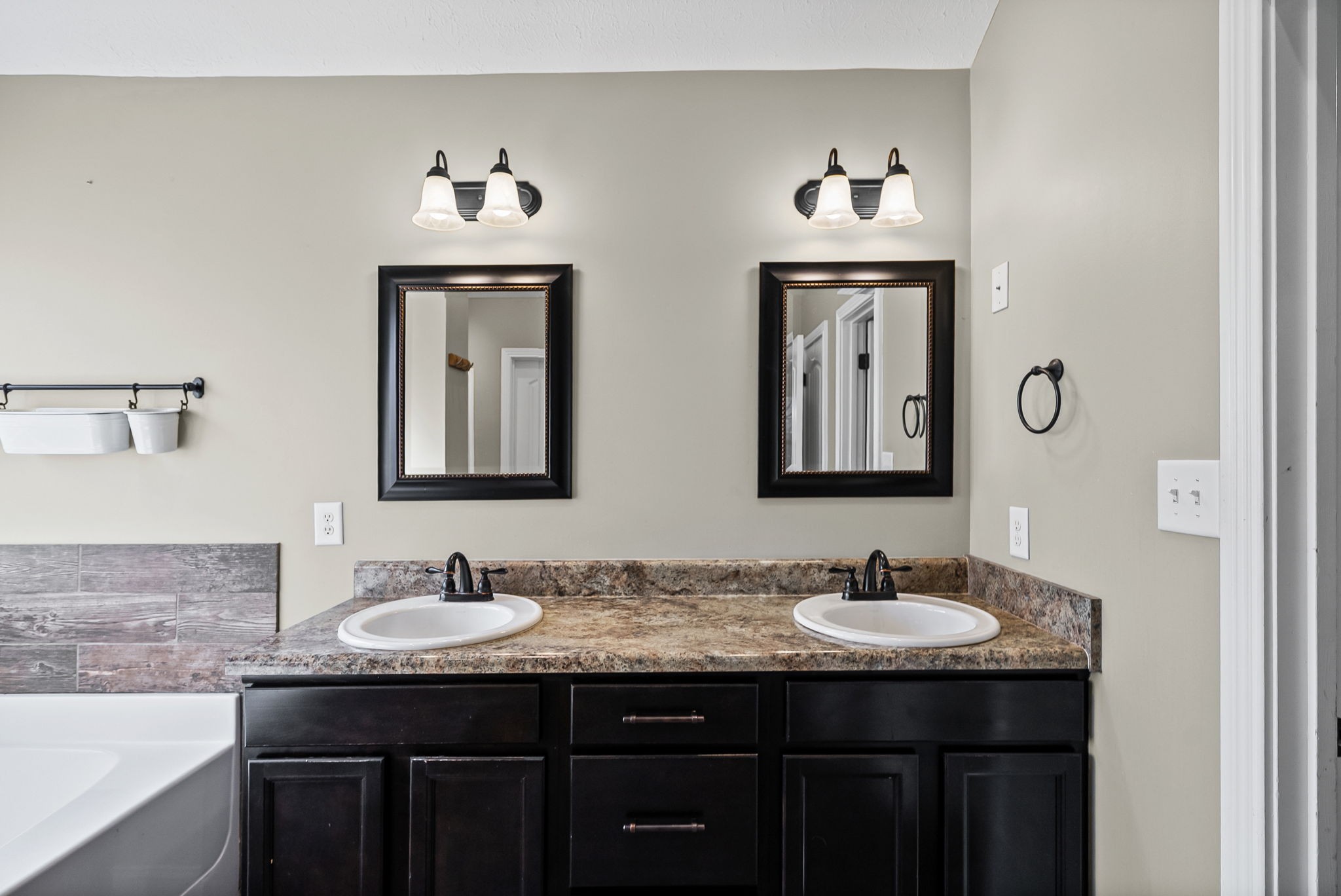1903 East Boy Scout Road Clarksville, TN 37042 - Photo 23 of 36 a bathroom with double vanity sinks and a mirror