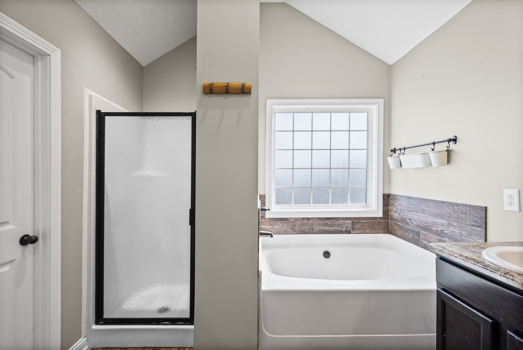 1903 East Boy Scout Road Clarksville, TN 37042 - Photo 24 of 36 a bathroom with a tub a sink and a window