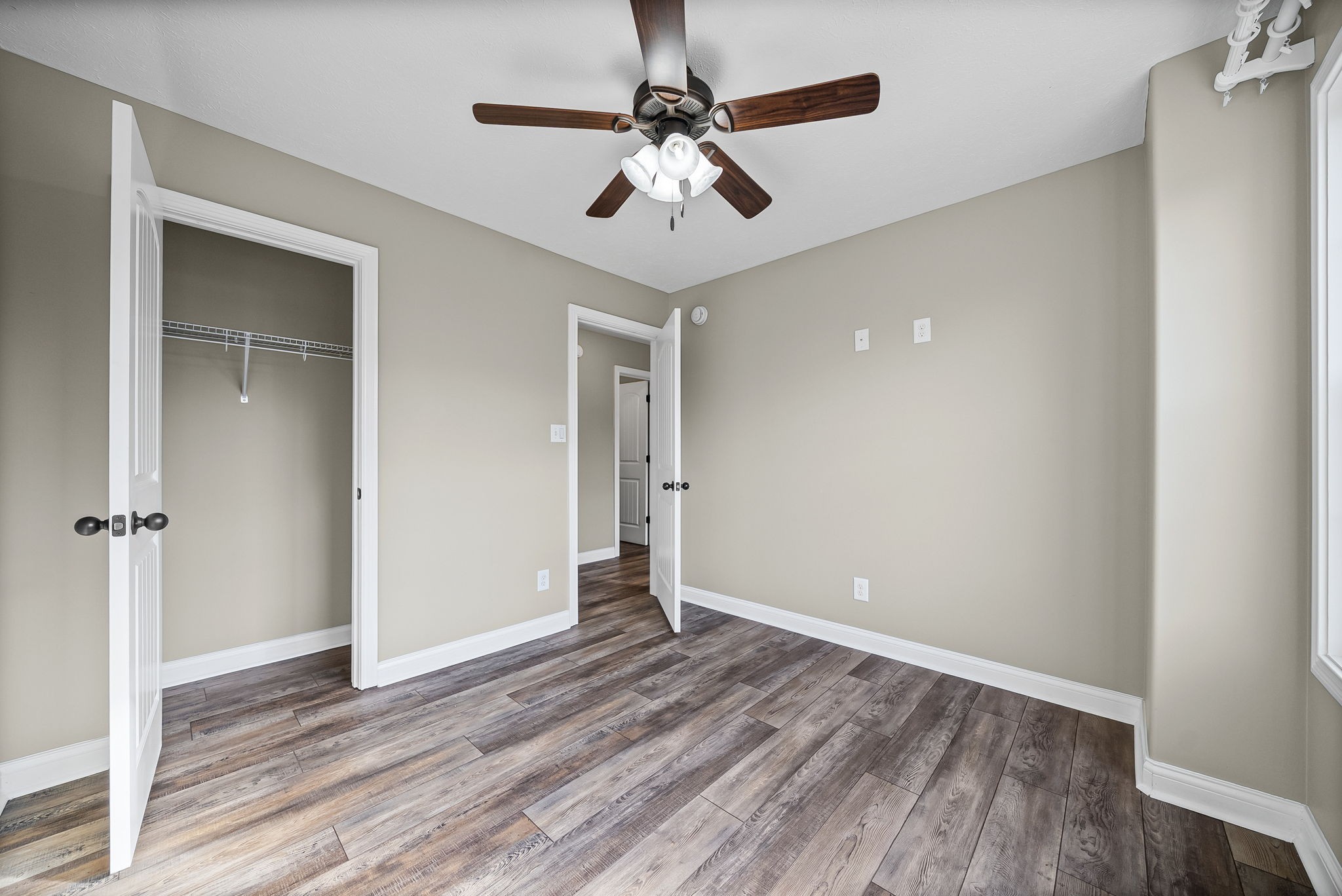 1903 East Boy Scout Road Clarksville, TN 37042 - Photo 27 of 36 wooden floor in an empty room with a window