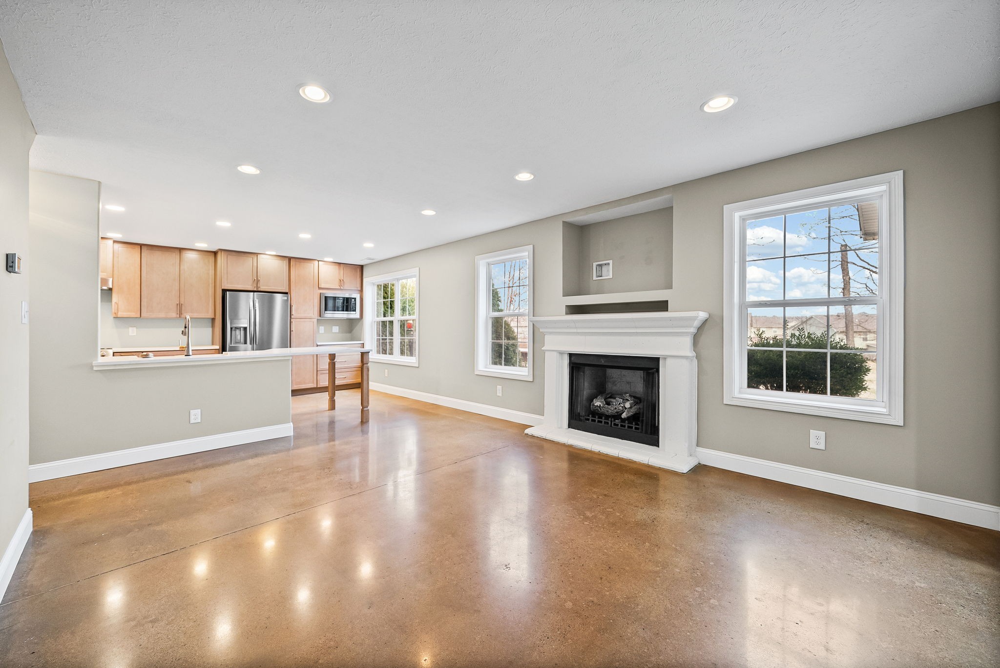 1903 East Boy Scout Road Clarksville, TN 37042 - Photo 8 of 36 a view of an empty room with a window and fireplace