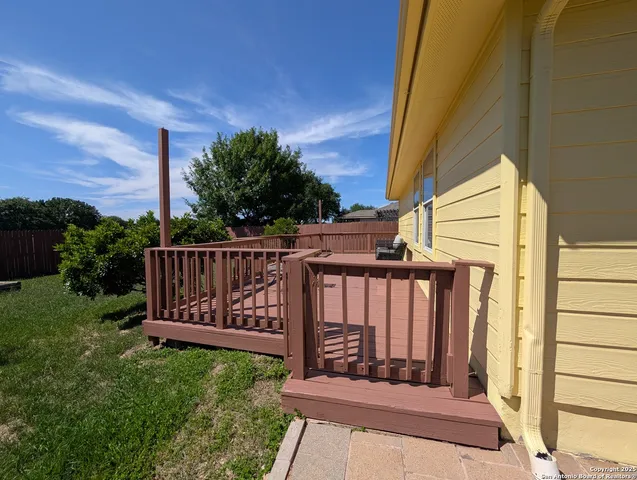 a view of a wooden door with a bench