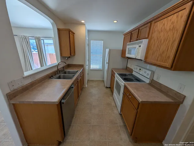 a kitchen with a cabinets and a sink