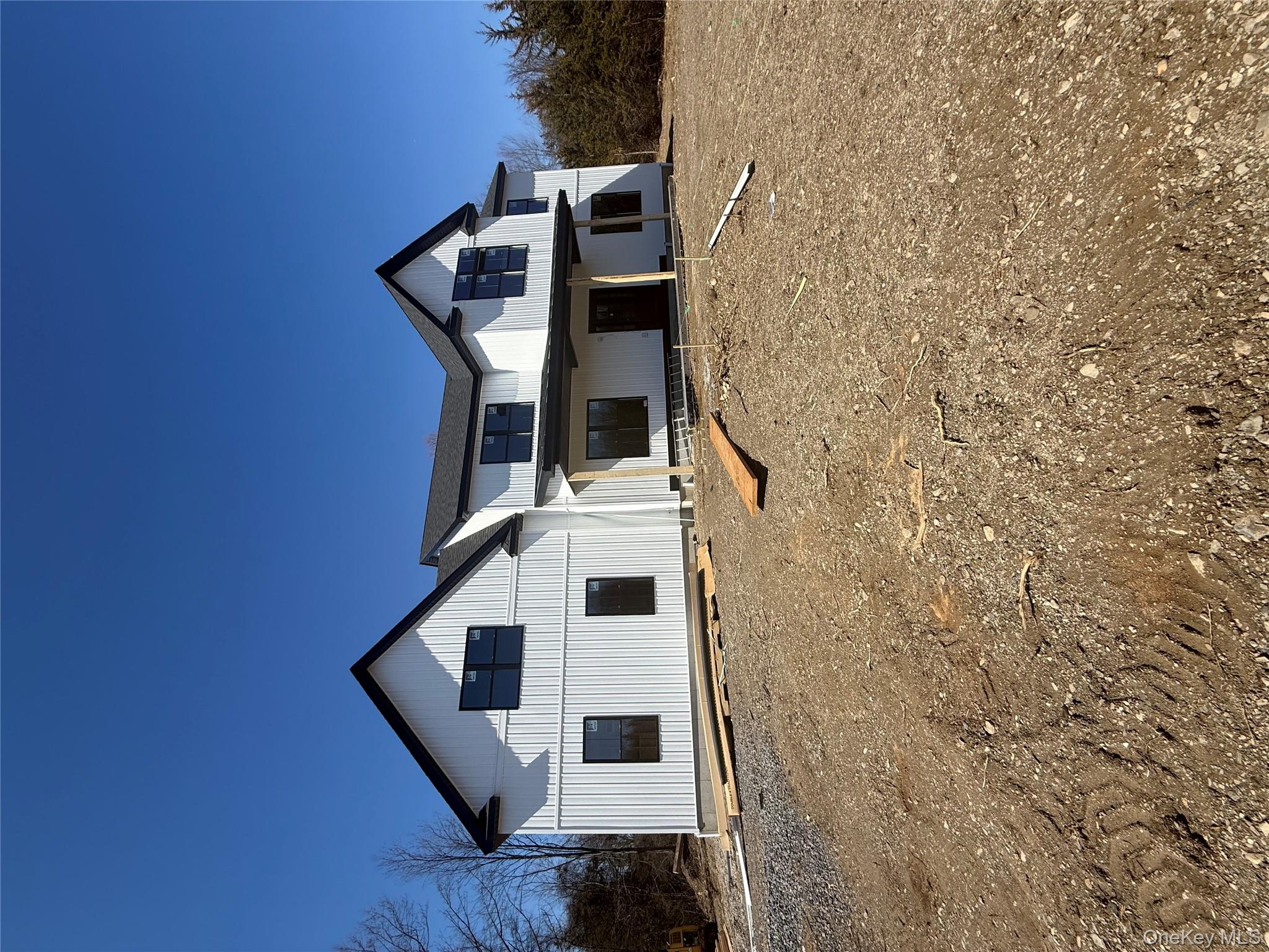 493 Union Corners Road Florida, NY 10921 - Photo 3 of 26 a front view of a house with a yard and garage