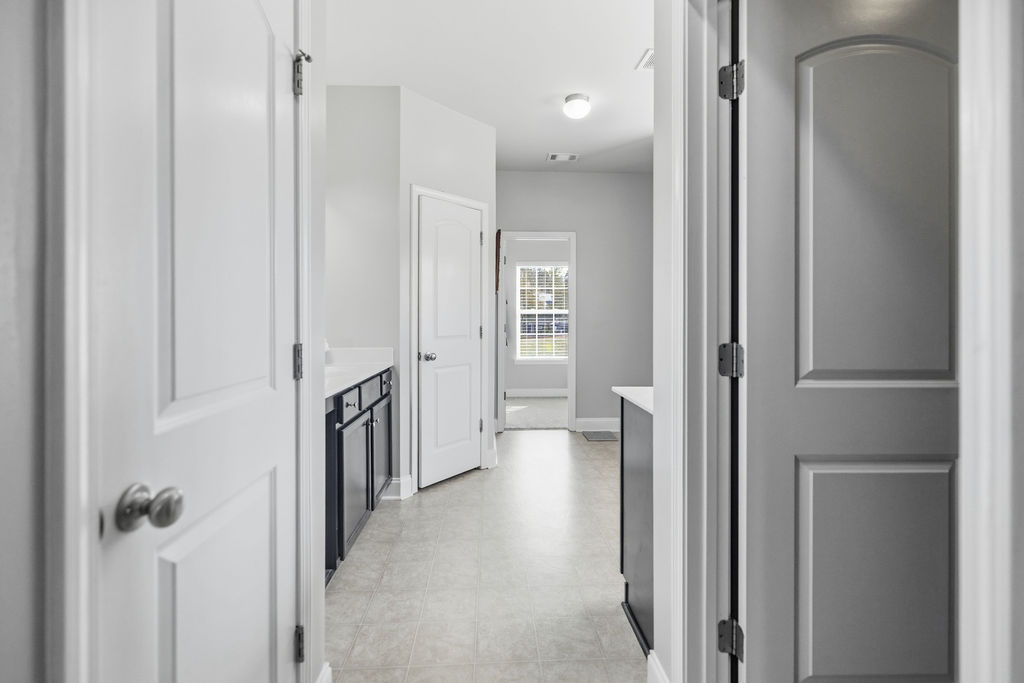 511 Cromer Road Townville, SC 29689 - Photo 20 of 45 This spacious hallway offers seamless flow, connecting various rooms with abundant natural light.