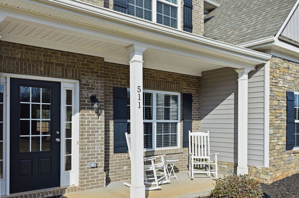 511 Cromer Road Townville, SC 29689 - Photo 2 of 45 The inviting front porch welcomes you to this charming residence with classic architectural elements.
