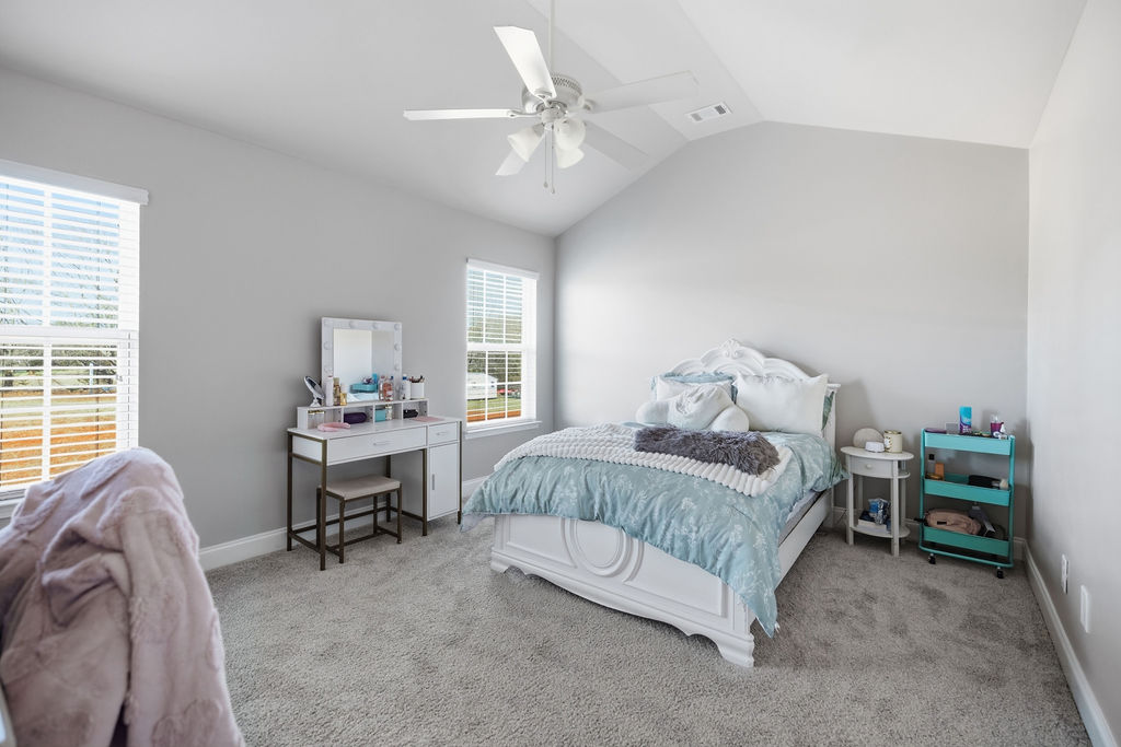 511 Cromer Road Townville, SC 29689 - Photo 30 of 45 This inviting bedroom features vaulted ceilings and ample natural light, creating a bright and airy retreat.