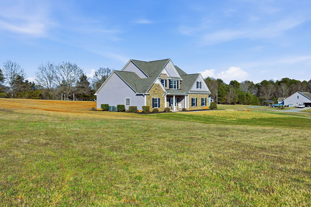 511 Cromer Road Townville, SC 29689 - Photo 4 of 45 This charming residence offers abundant curb appeal and a serene, expansive yard.