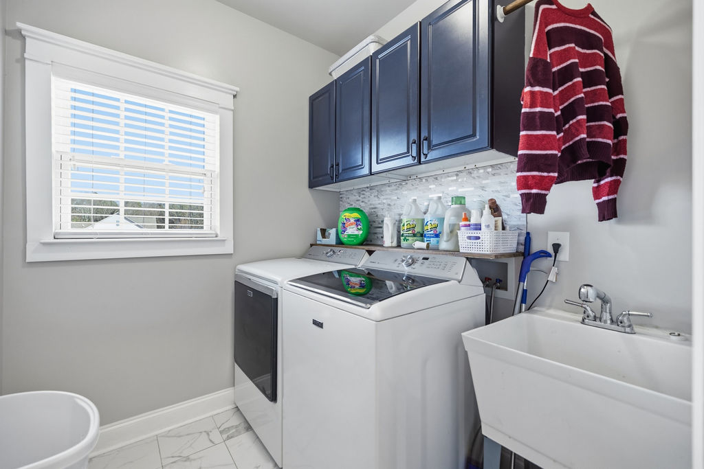 511 Cromer Road Townville, SC 29689 - Photo 41 of 45 This functional laundry room offers convenient appliances and ample storage for everyday tasks.