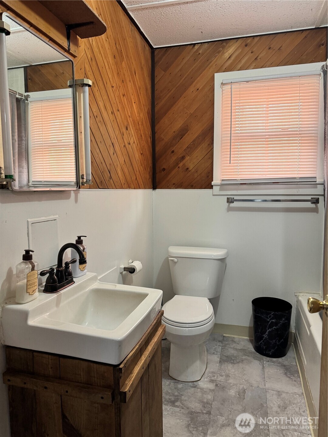 61 North Kean Street Republic, WA 99166 - Photo 29 of 34 a bathroom with a sink a toilet and a window
