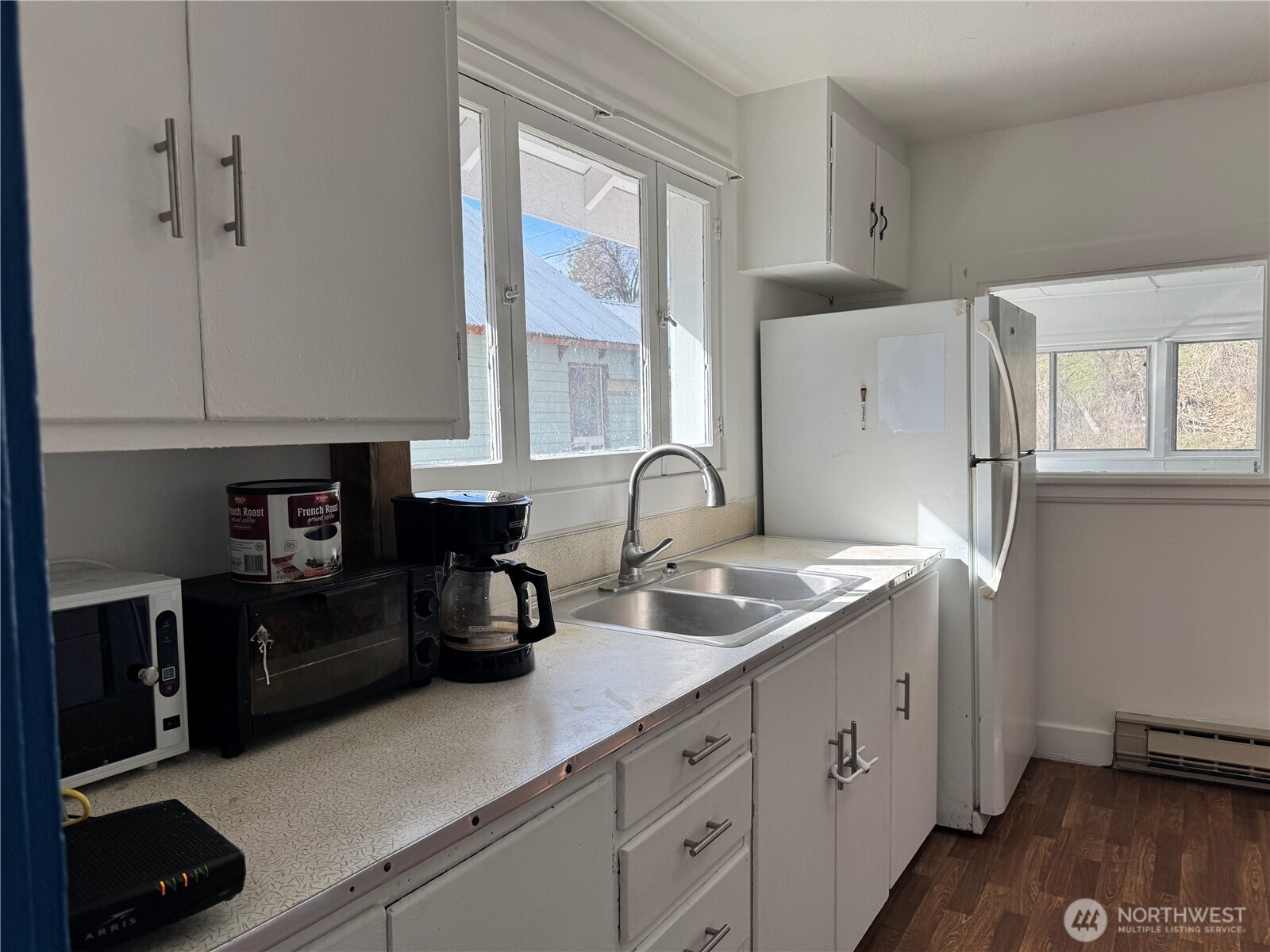 61 North Kean Street Republic, WA 99166 - Photo 9 of 34 a kitchen with a sink and cabinets