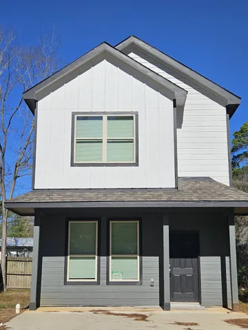 a front view of a house with garage