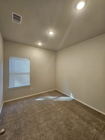 an empty room with a empty space and window