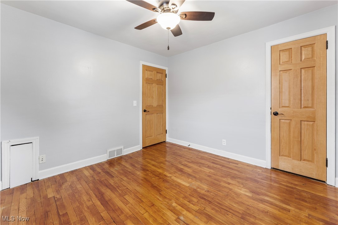 1703 Ferndale Road Northwest Canton, OH 44709 - Photo 16 of 34 Unfurnished room featuring a ceiling fan and light wood finished floors