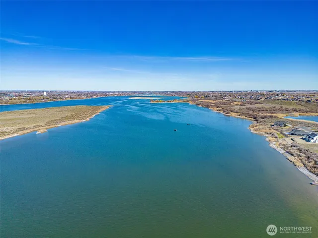 a view of a lake with a big yard