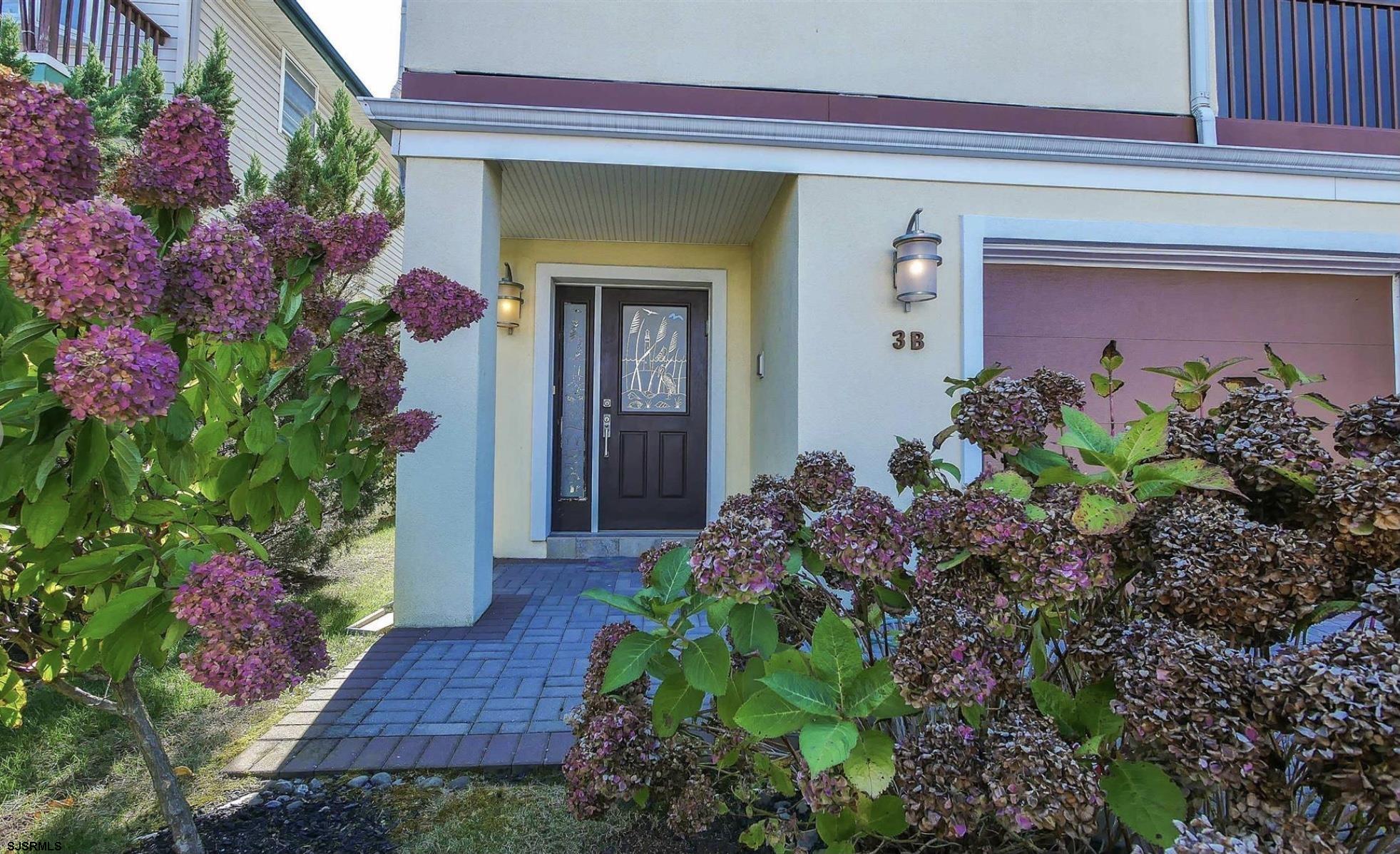 214 North Decatur Avenue, Unit 3B Margate City, NJ 08402 - Photo 3 of 41 a view of a backyard with flowers