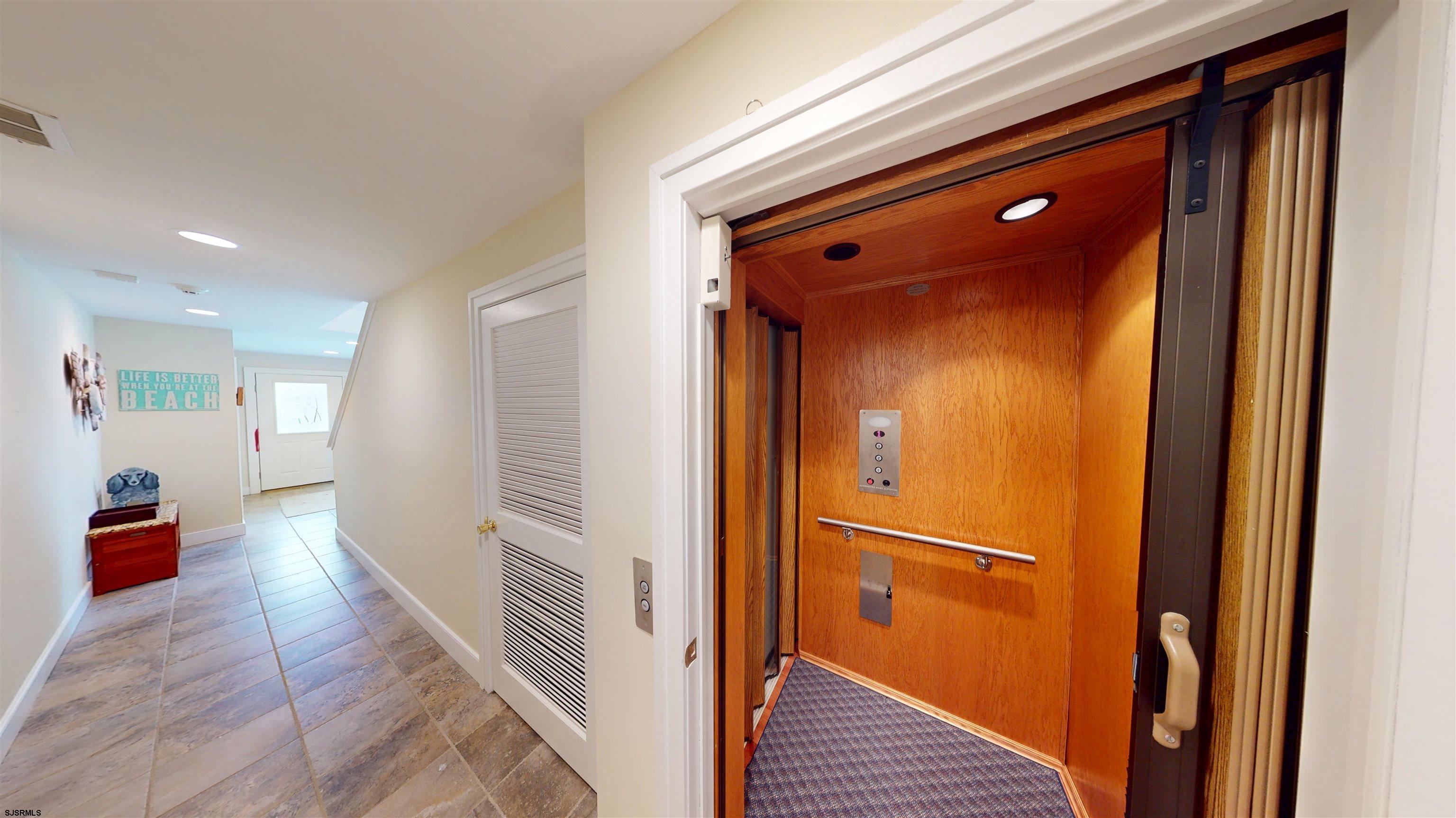 214 North Decatur Avenue, Unit 3B Margate City, NJ 08402 - Photo 5 of 41 a view of a hallway with wooden floor and staircase