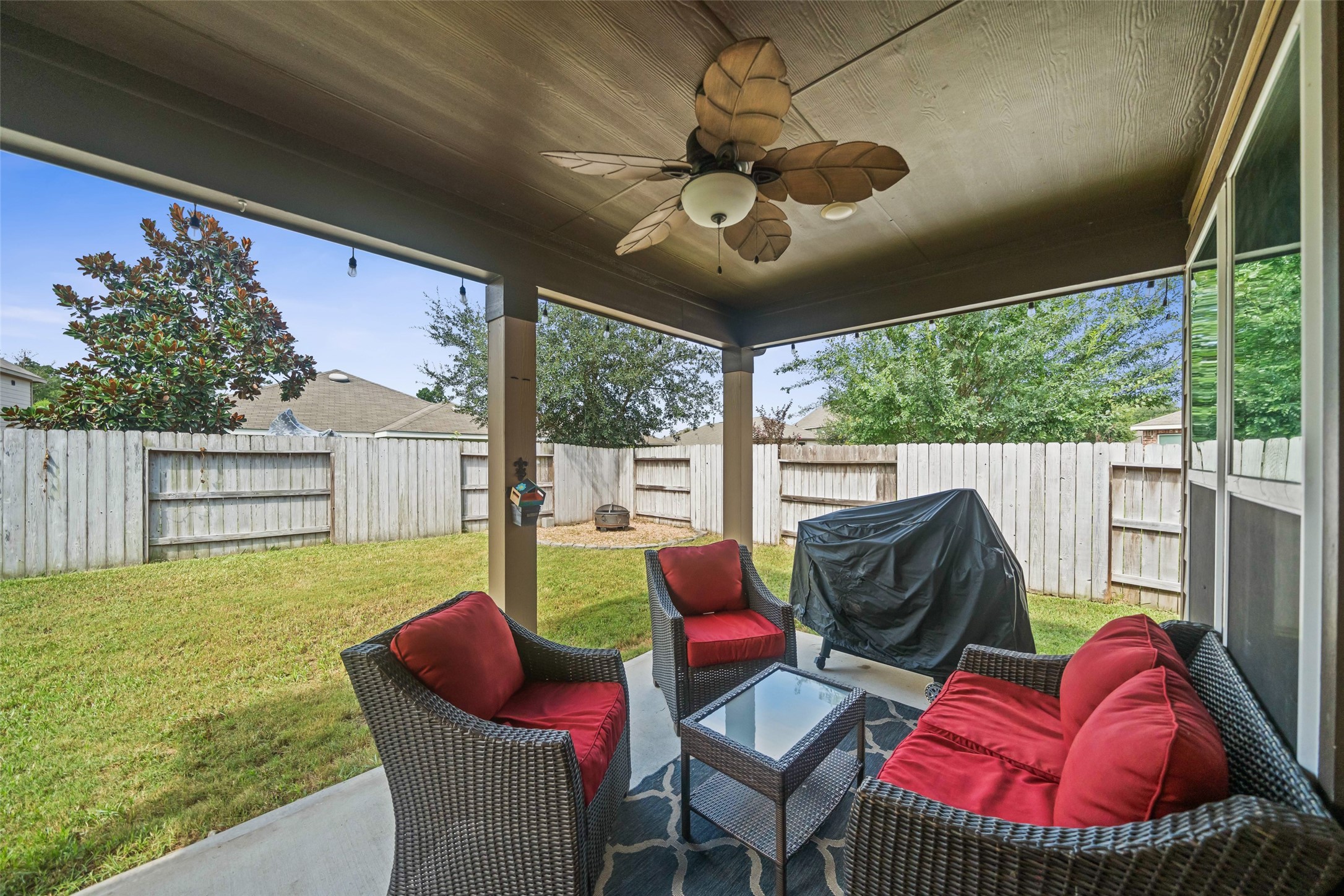 1118 Upton Court Conroe, TX 77304 - Photo 3 of 25 Covered Patio with a ceiling fan and lights!