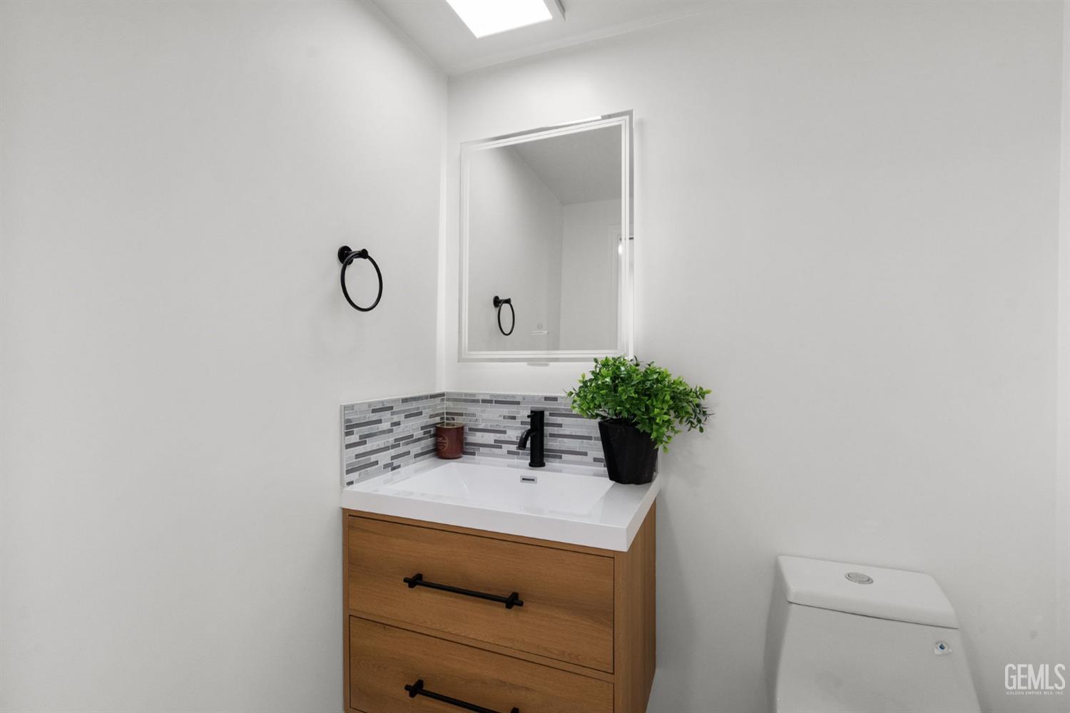 Undisclosed Address Sun Valley, CA 91352 - Photo 13 of 44 a bathroom with a sink a vanity and a mirror