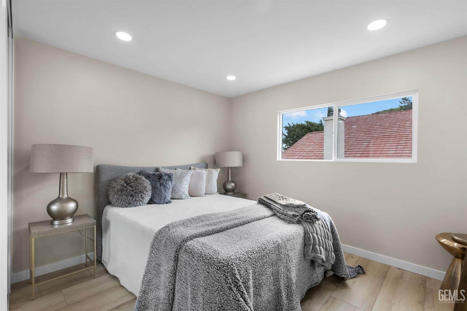 Undisclosed Address Sun Valley, CA 91352 - Photo 30 of 44 a bed room with a bed and chair