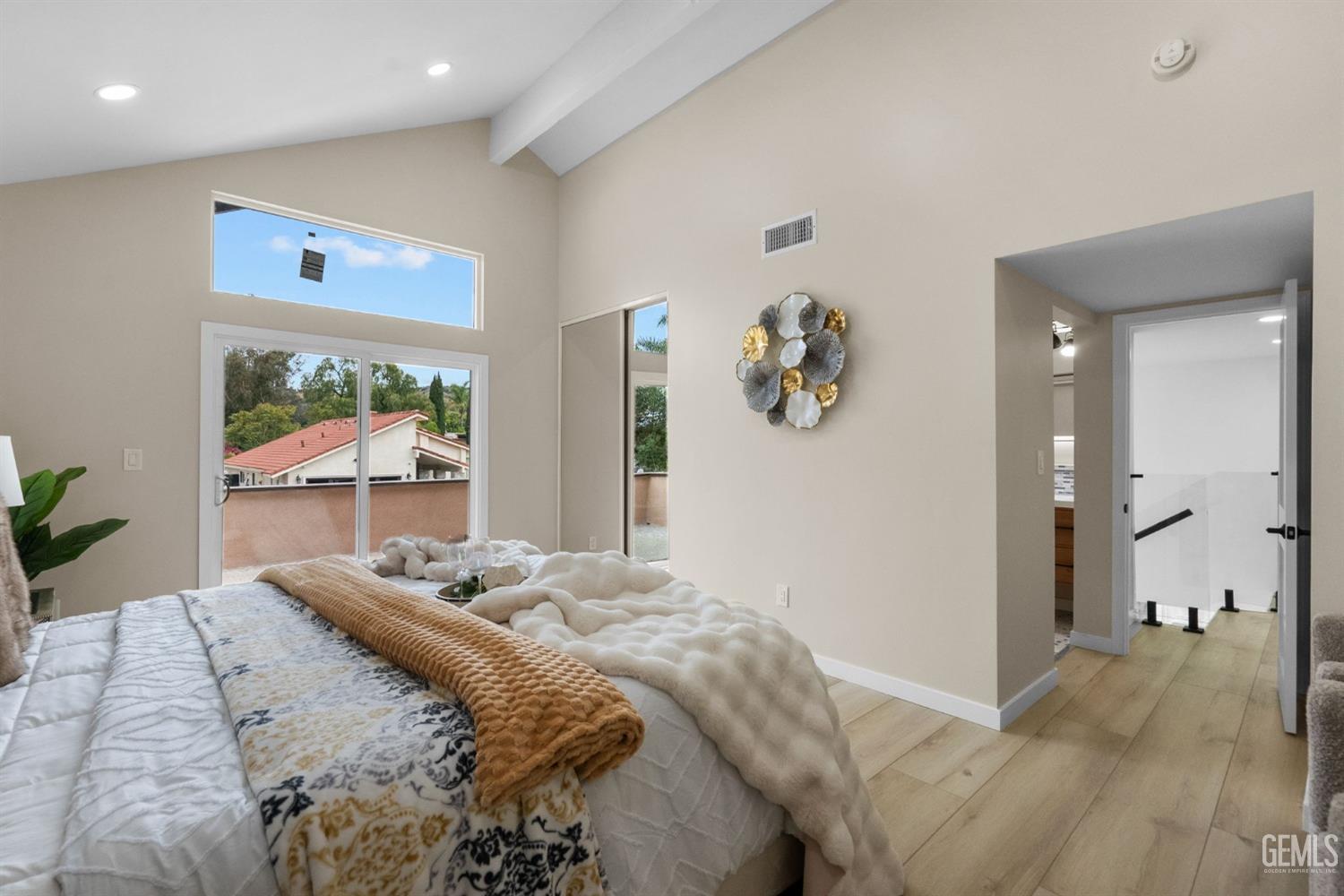 Undisclosed Address Sun Valley, CA 91352 - Photo 39 of 44 a bedroom with a large bed and a chandelier