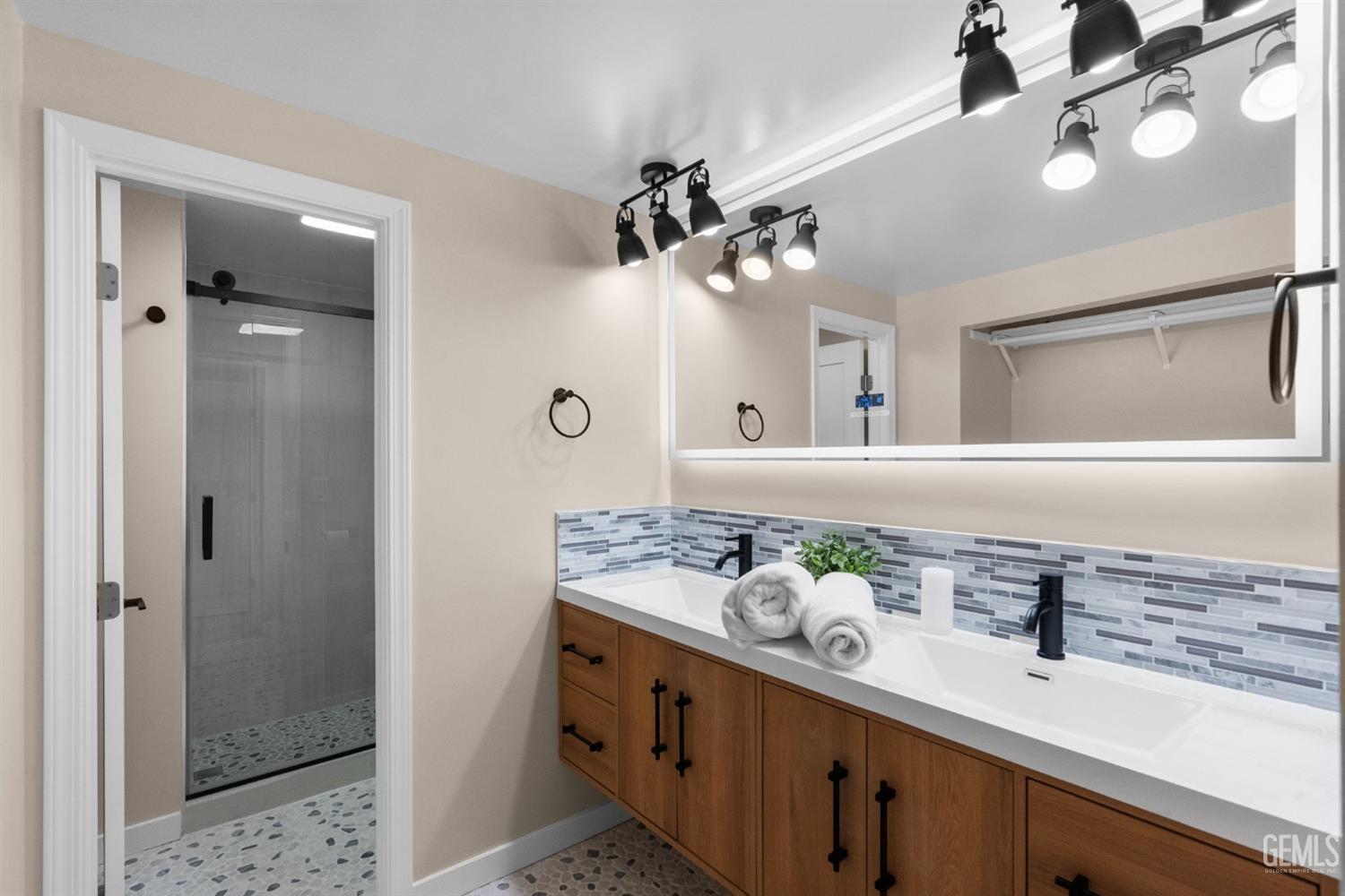 Undisclosed Address Sun Valley, CA 91352 - Photo 44 of 44 a bathroom with a double vanity sink and a mirror