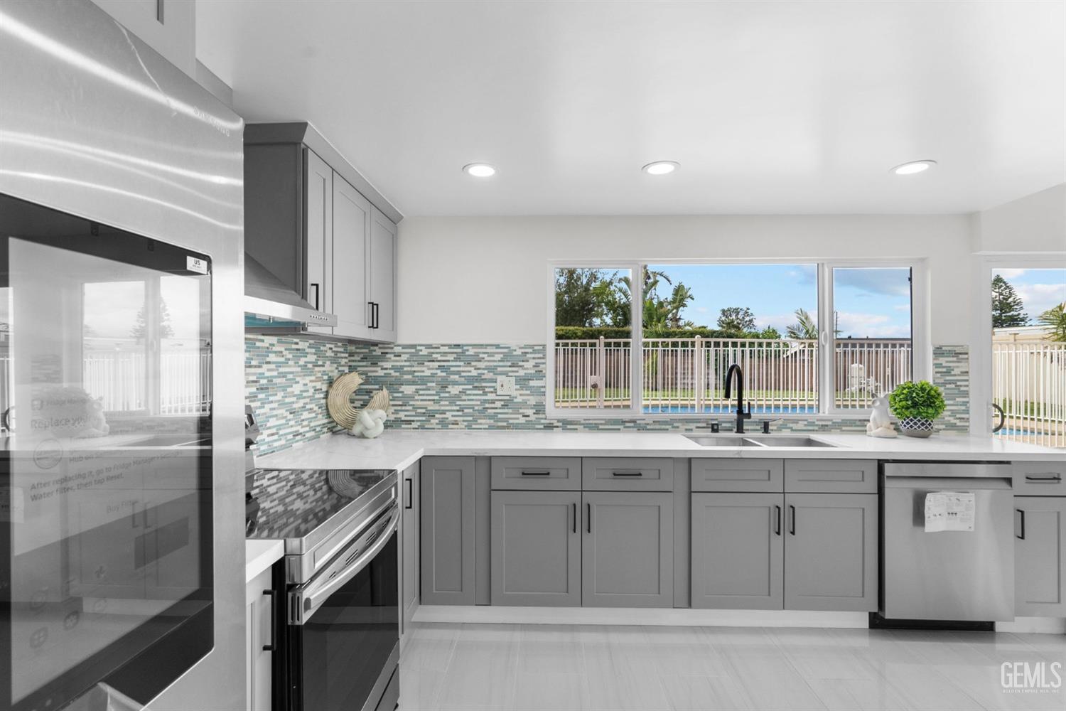 Undisclosed Address Sun Valley, CA 91352 - Photo 6 of 44 a kitchen with stainless steel appliances granite countertop a sink and a stove