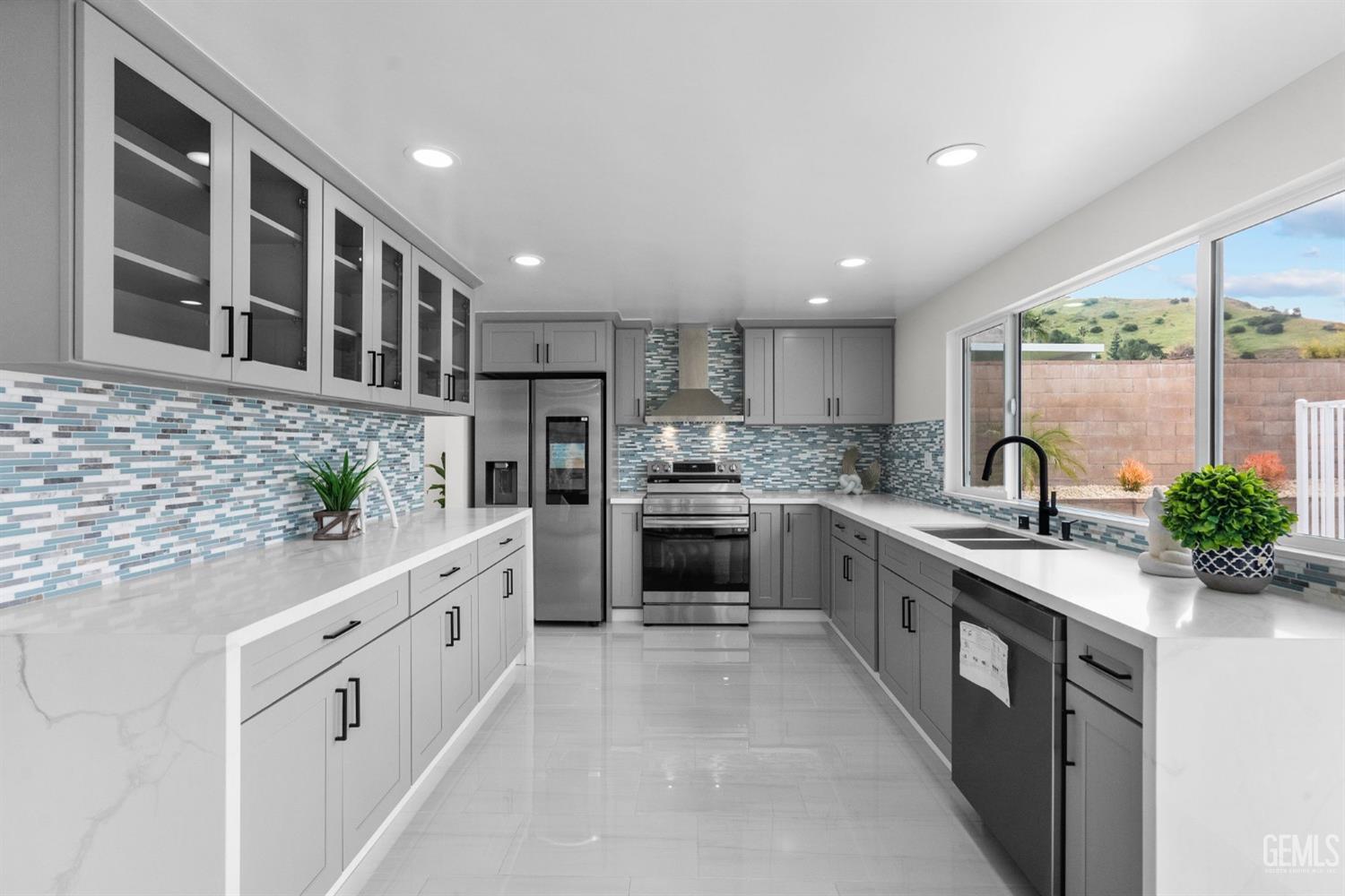 Undisclosed Address Sun Valley, CA 91352 - Photo 8 of 44 a kitchen with stainless steel appliances granite countertop a stove and more cabinets