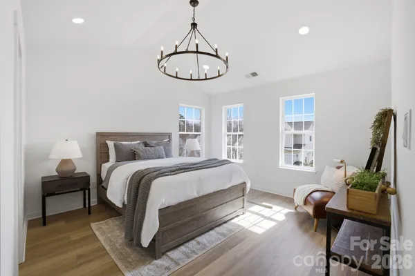a bedroom with bed and a window