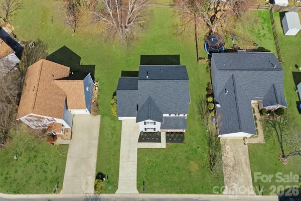 an aerial view of a house with outdoor space