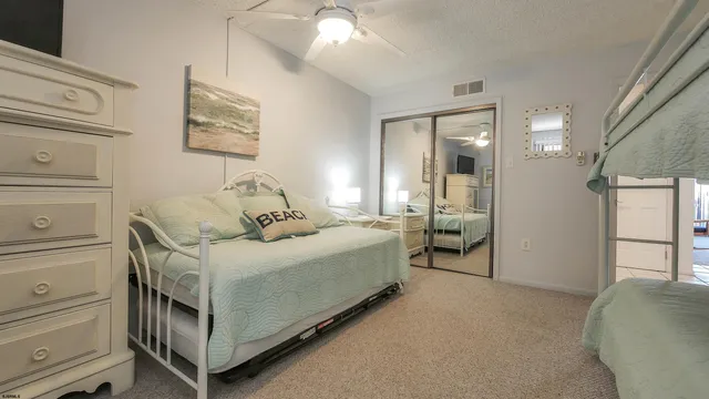 a spacious bedroom with a bed and a window