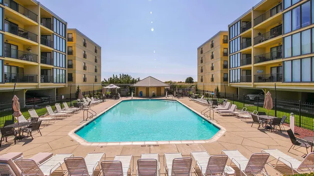 a view of swimming pool with outdoor seating