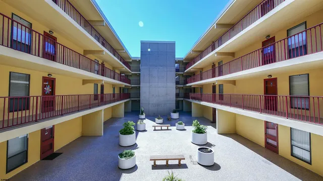 a view of an chairs and table in the balcony