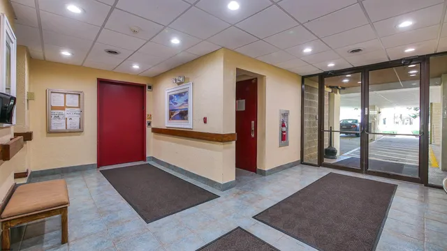 a view of an empty room with a fireplace