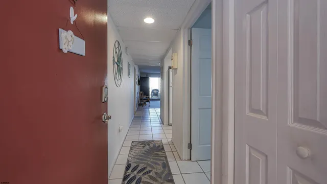a view of hallway with a large mirror