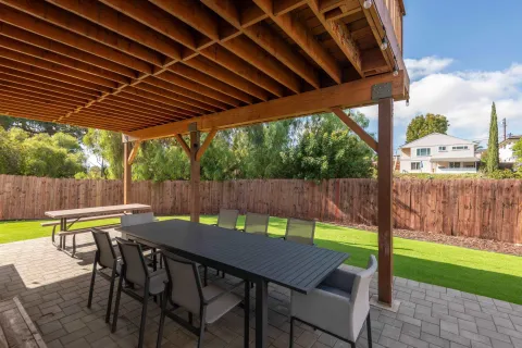 an outdoor space with furniture and umbrella
