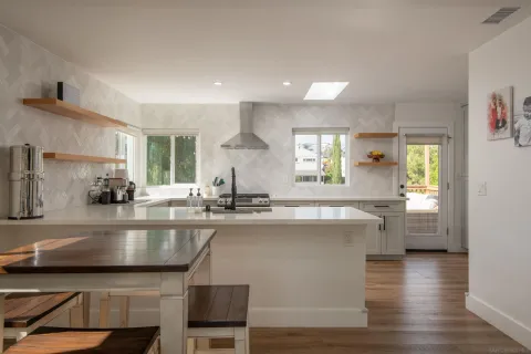 a kitchen with a sink and wooden cabinets
