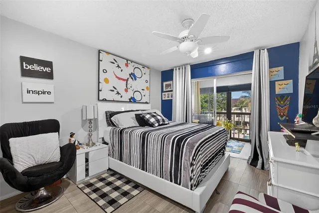 a bed room with a bed and glass window