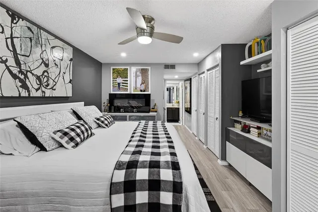 a large white kitchen with a large window