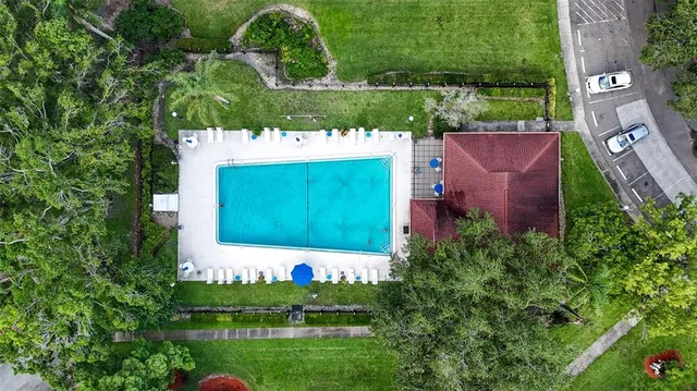a view of a red brick house with a yard