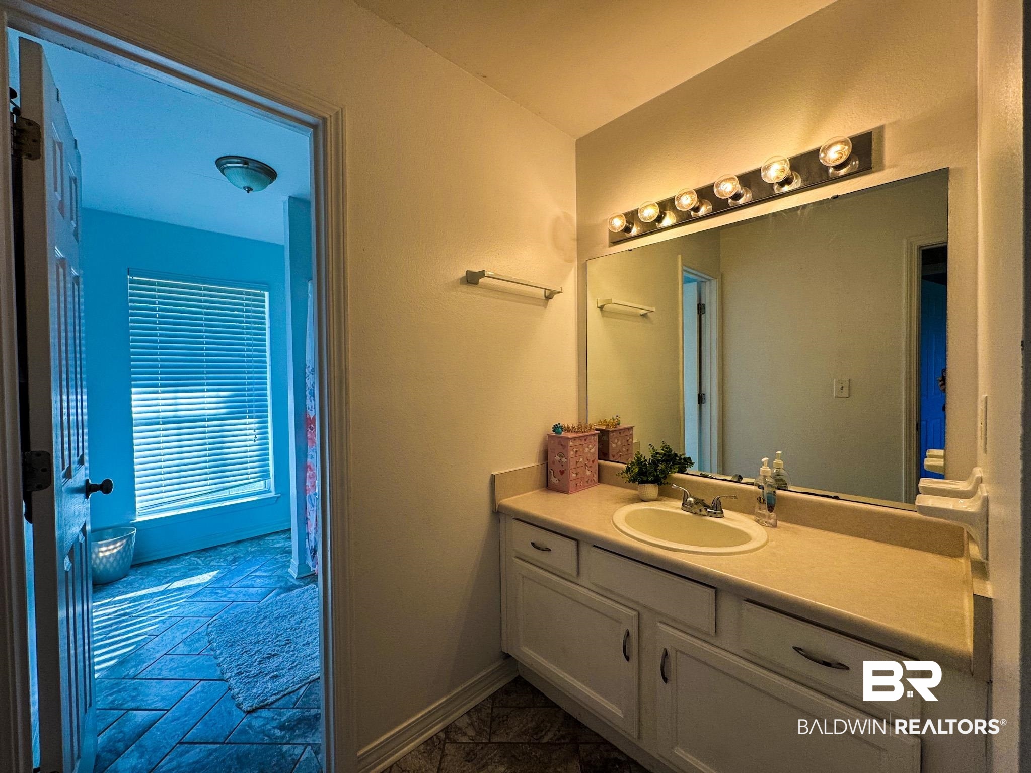 8927 Gryder Street Foley, AL 36535 - Photo 13 of 18 Bathroom featuring vanity and baseboards