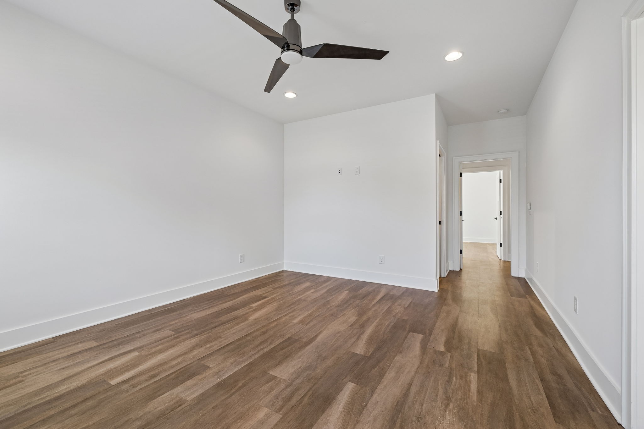 904 North Maple Street Murfreesboro, TN 37130 - Photo 19 of 34 a view of a room with wooden floor a ceiling fan and window