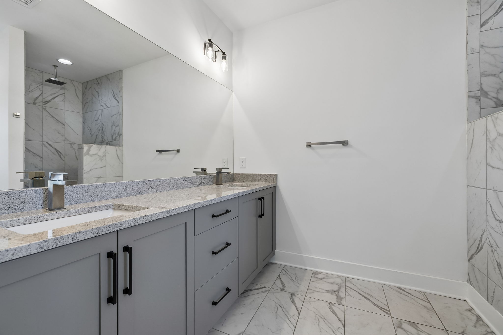 904 North Maple Street Murfreesboro, TN 37130 - Photo 20 of 34 a bathroom with a granite countertop sink and a mirror