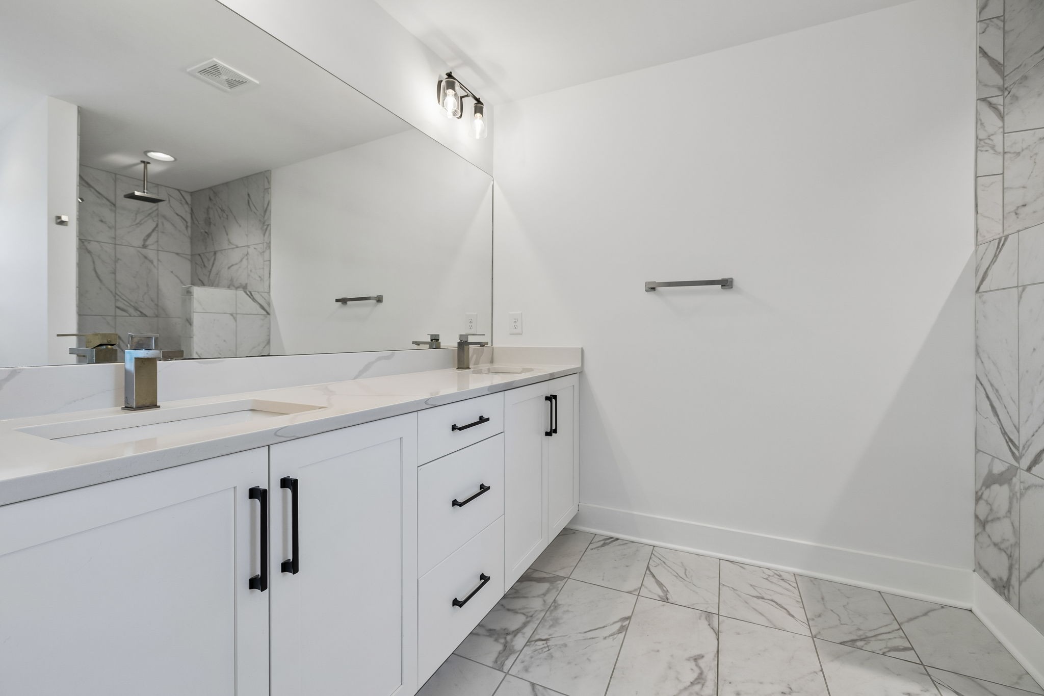 904 North Maple Street Murfreesboro, TN 37130 - Photo 24 of 34 a bathroom with a double vanity sink and mirror