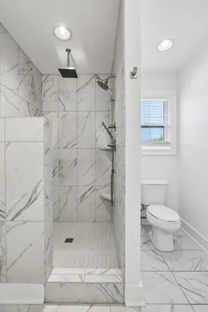a view of storage and utility room with washer and dryer