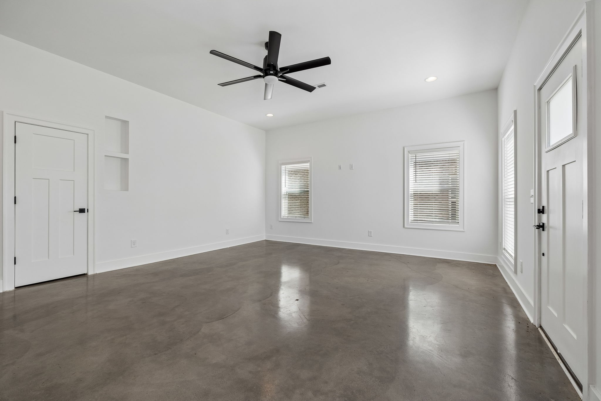 904 North Maple Street Murfreesboro, TN 37130 - Photo 9 of 34 an empty room with wooden floor closet and windows